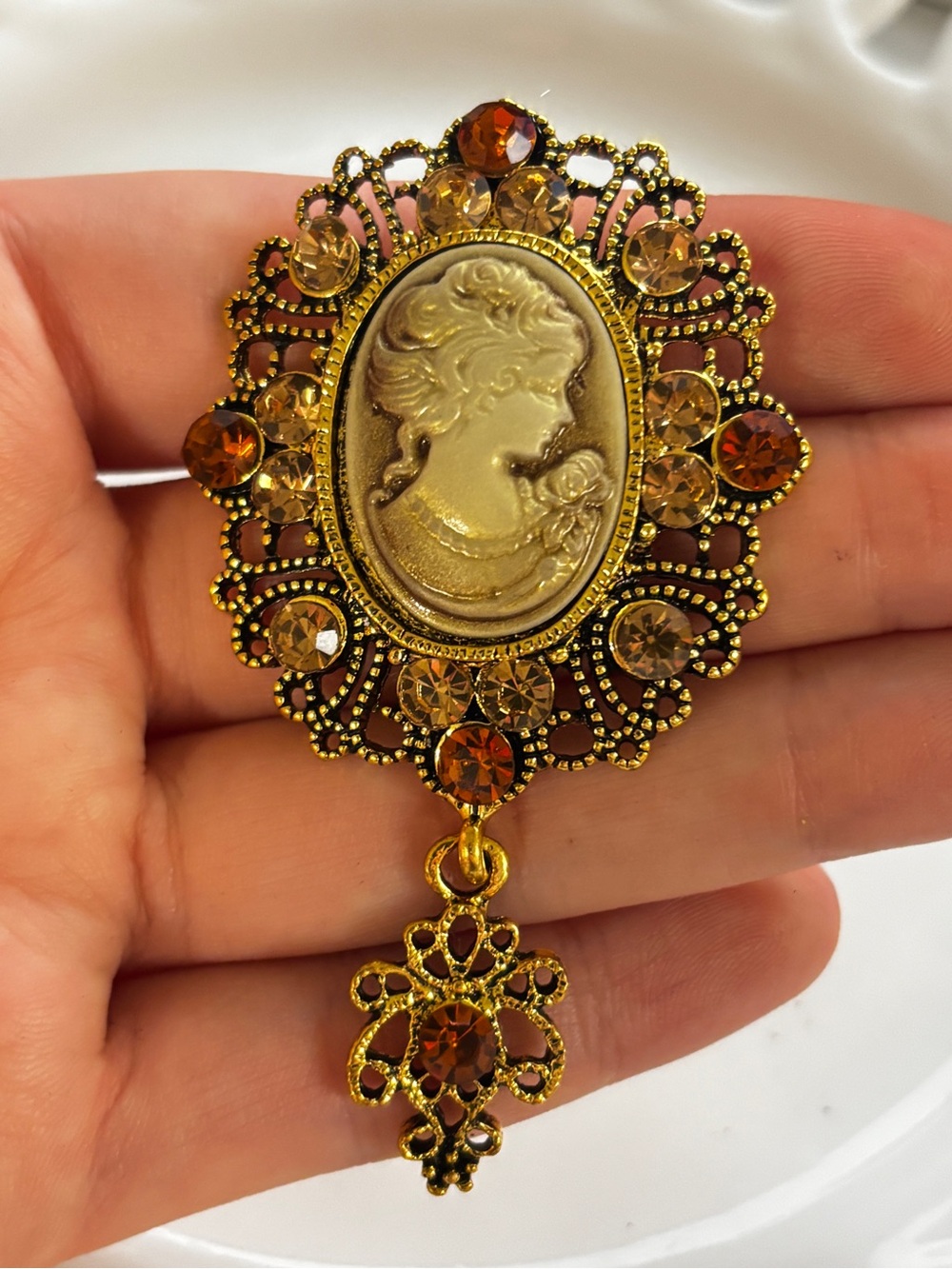 Antique Gold tone Cameo Brooch with Amber colored gemstones